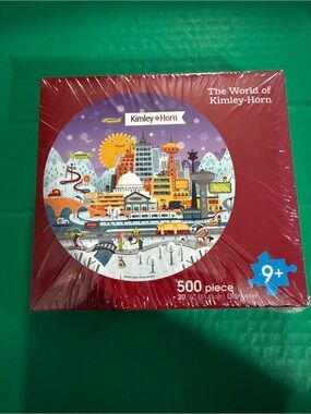 Kimley-Horn 500-Piece Round Puzzle - Red Box with Colorful City Illustration